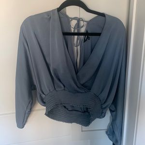 Express long sleeve, cropped, deep v in front and back, ties in back